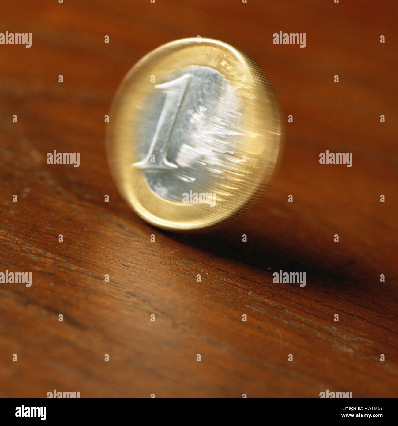 Euro coin rolling on table Stock Photo Alamy