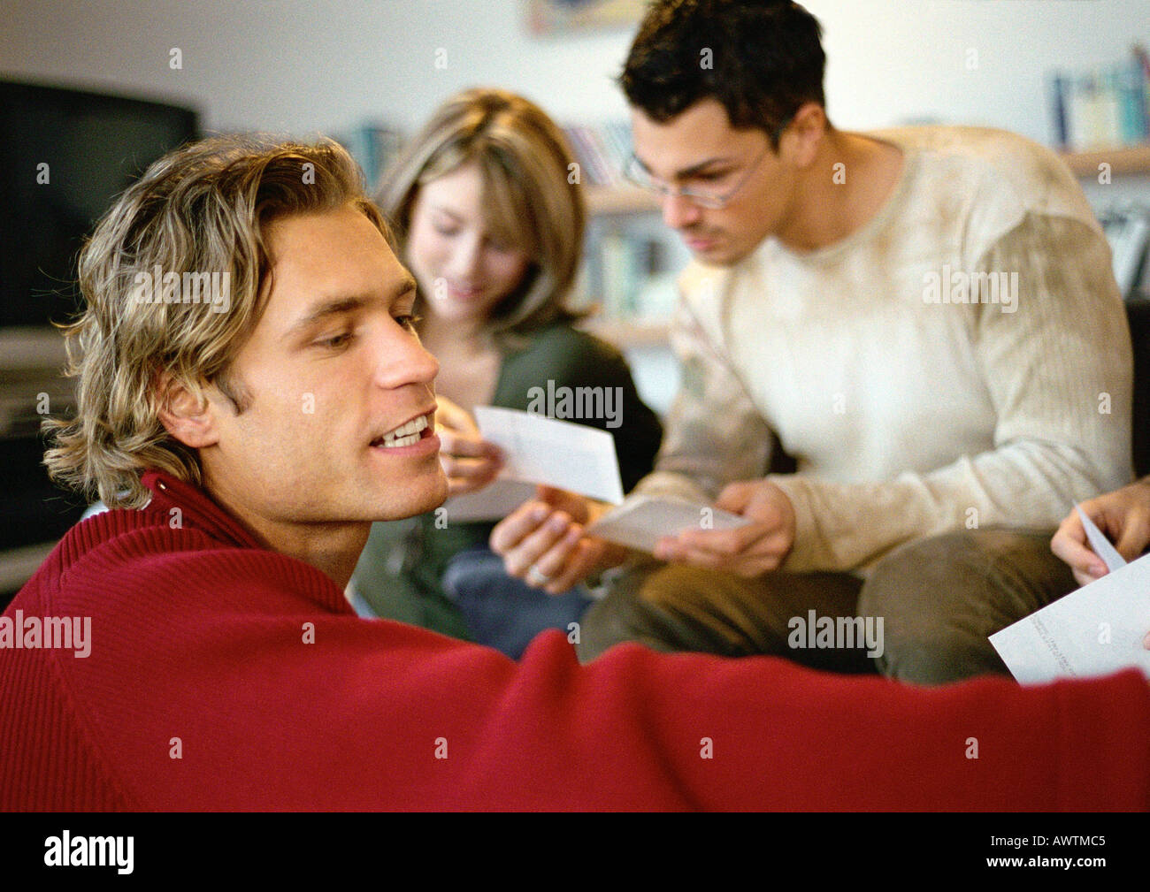 Group of people looking at photos Stock Photo - Alamy