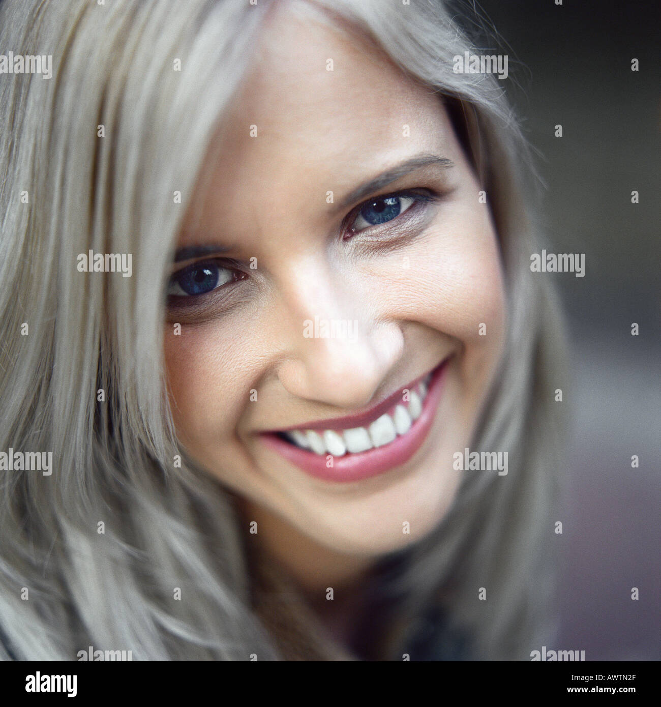 Woman looking at camera, smiling, portrait Stock Photo