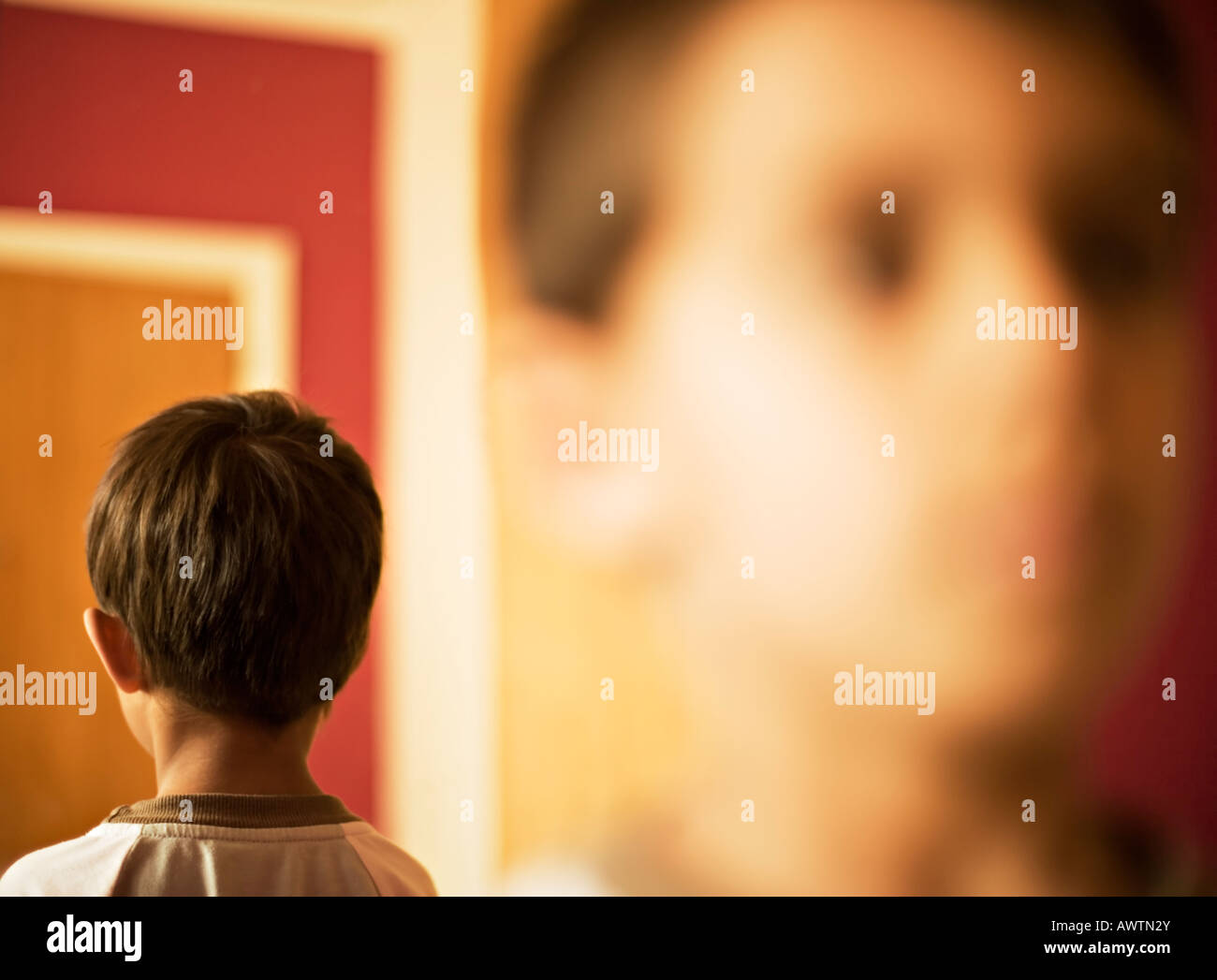 Face with back of head reflected in a mirror Stock Photo Alamy