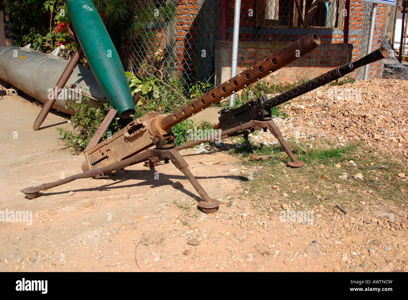 Laos Phonsavan Vietnam War armaments bomb casings and heavy machine guns outside hotel Stock Photo