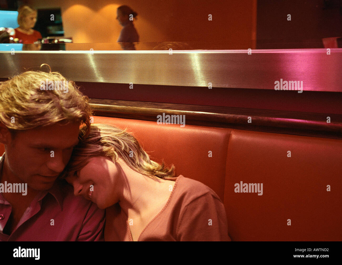 Couple sitting in restaurant booth hires stock photography and images