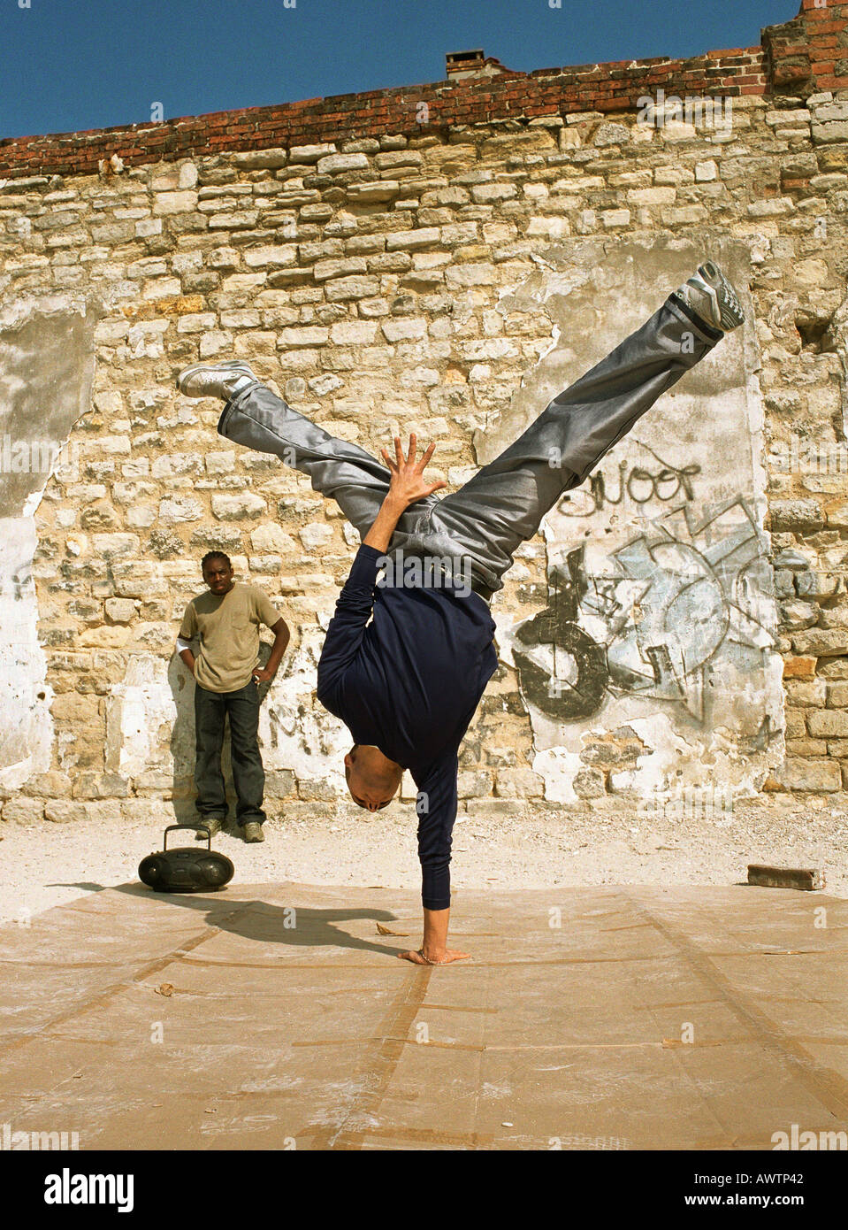 Man balancing on one hand, break dancing Stock Photo