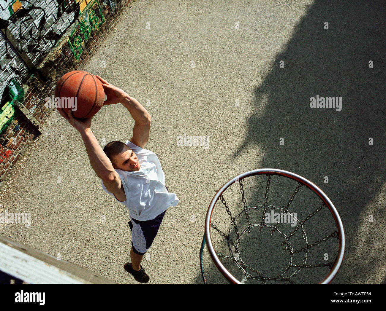 Man going up for a basketball dunk, shot from above Stock Photo Alamy