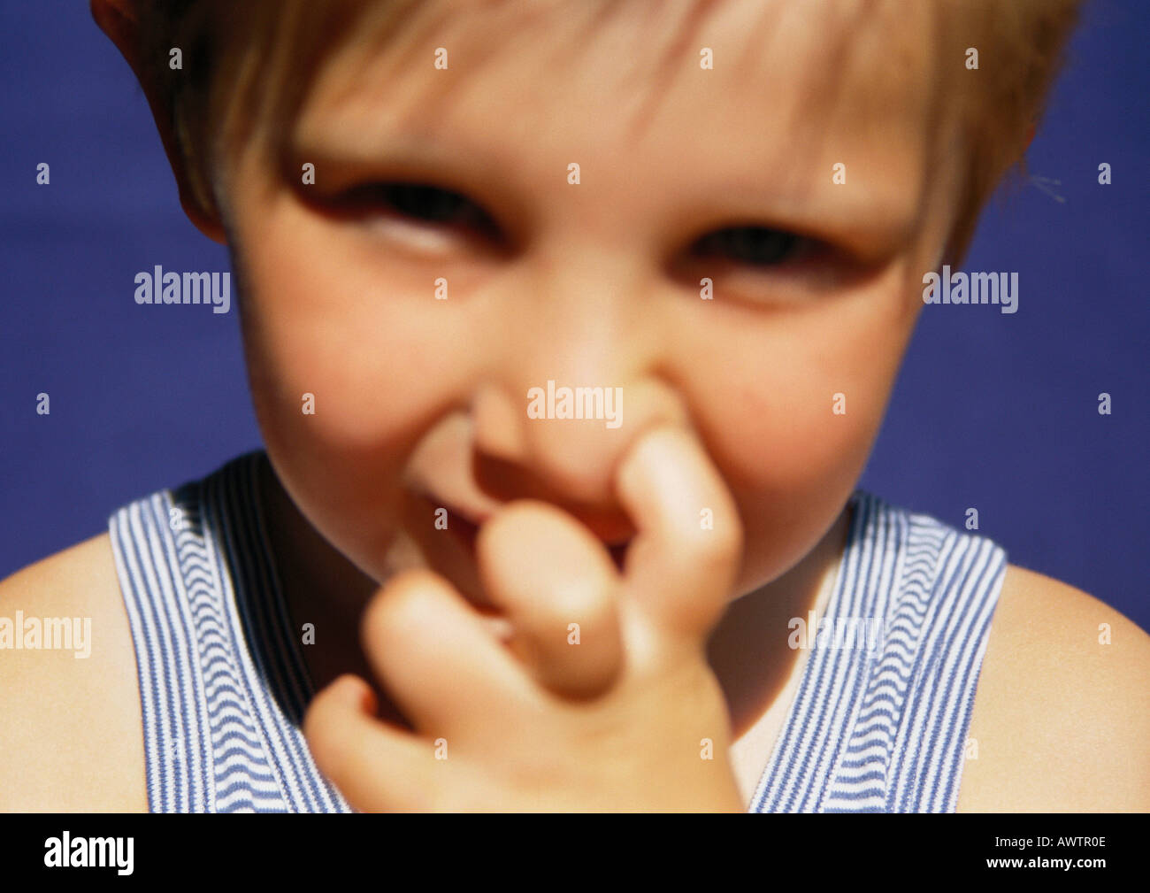 Child with finger in nose, closeup Stock Photo Alamy