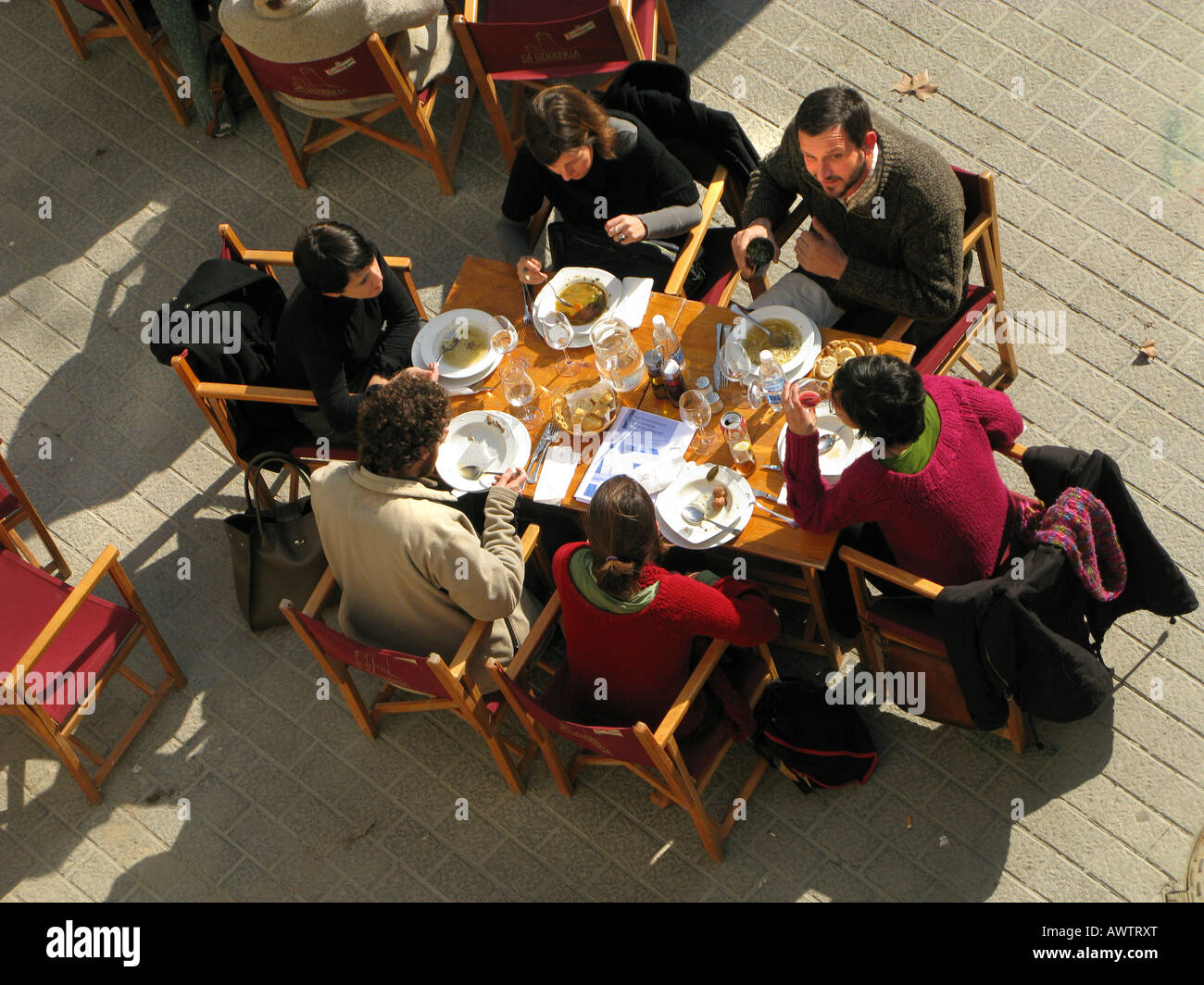 Lunch party outdoors in old Palma, Mallorca, Spain. Photographed from above Stock Photo