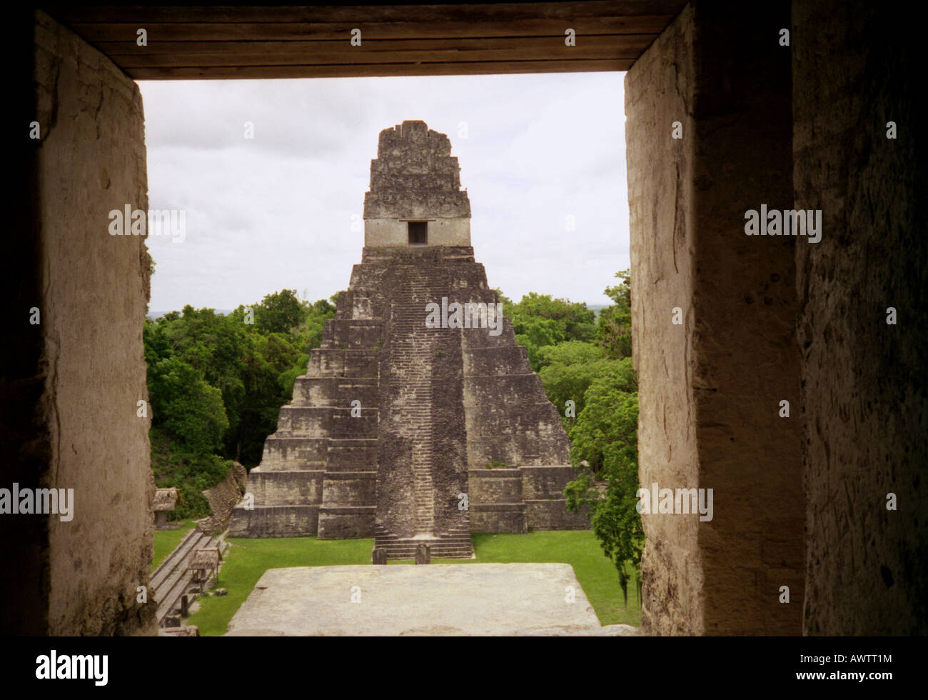 Panoramic view imposing Maya stone pyramid through entry door at top its opposite Tikal Guatemala Central Latin America Stock Photo