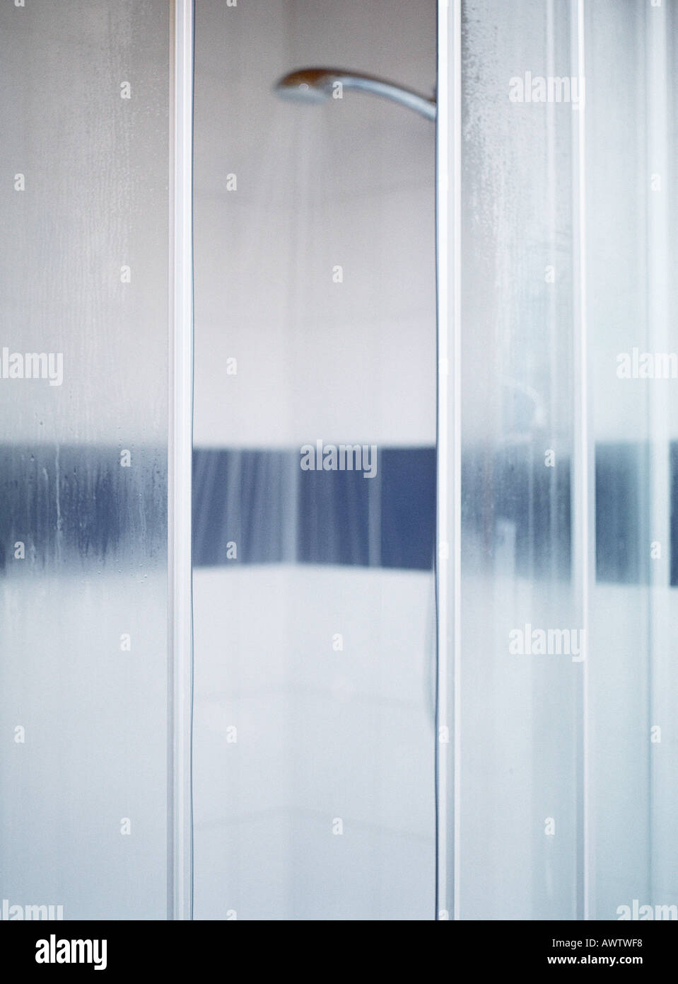 Open shower doors, water running, blurred Stock Photo Alamy