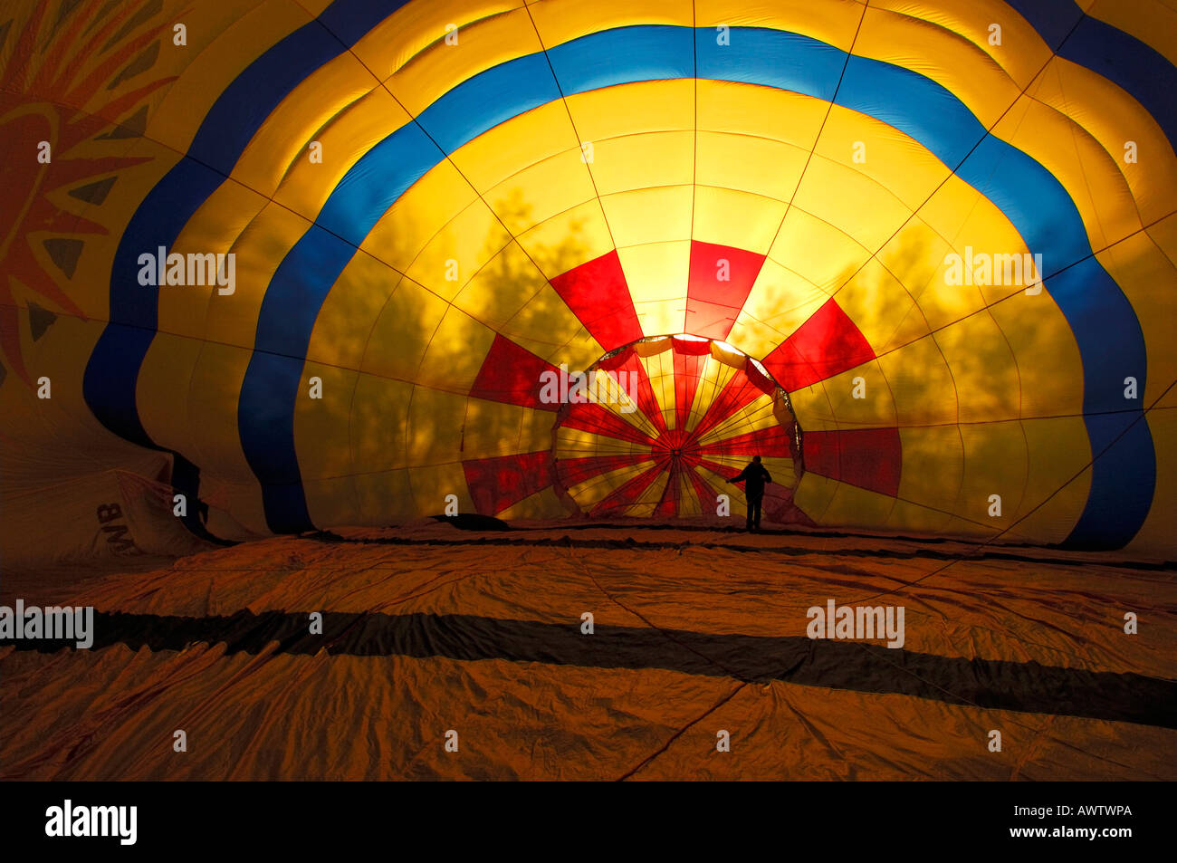 Inflating a hot air balloon with petrol powered fan Stock Photo Alamy