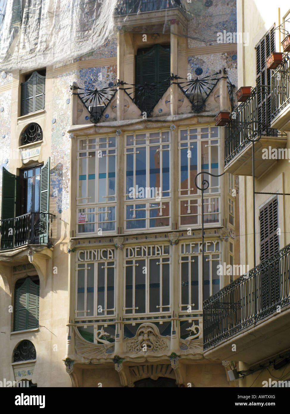 Enclosed glass balcony, or verandah window, with the writing: Clinica Dental - Palma, Mallorca, Spain Stock Photo