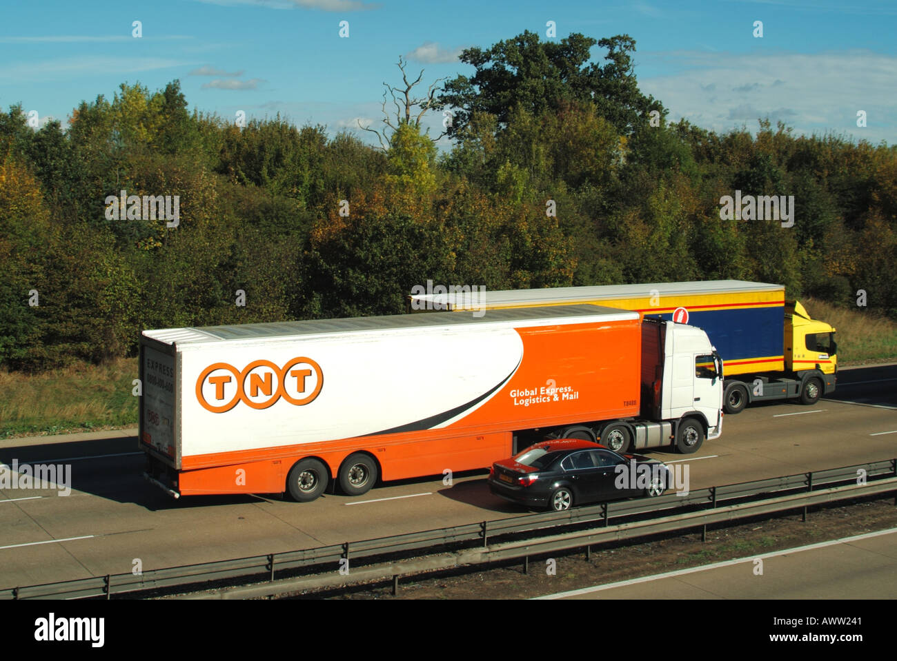 M25 motorway three lane overtaking by lorries and car Stock Photo Alamy