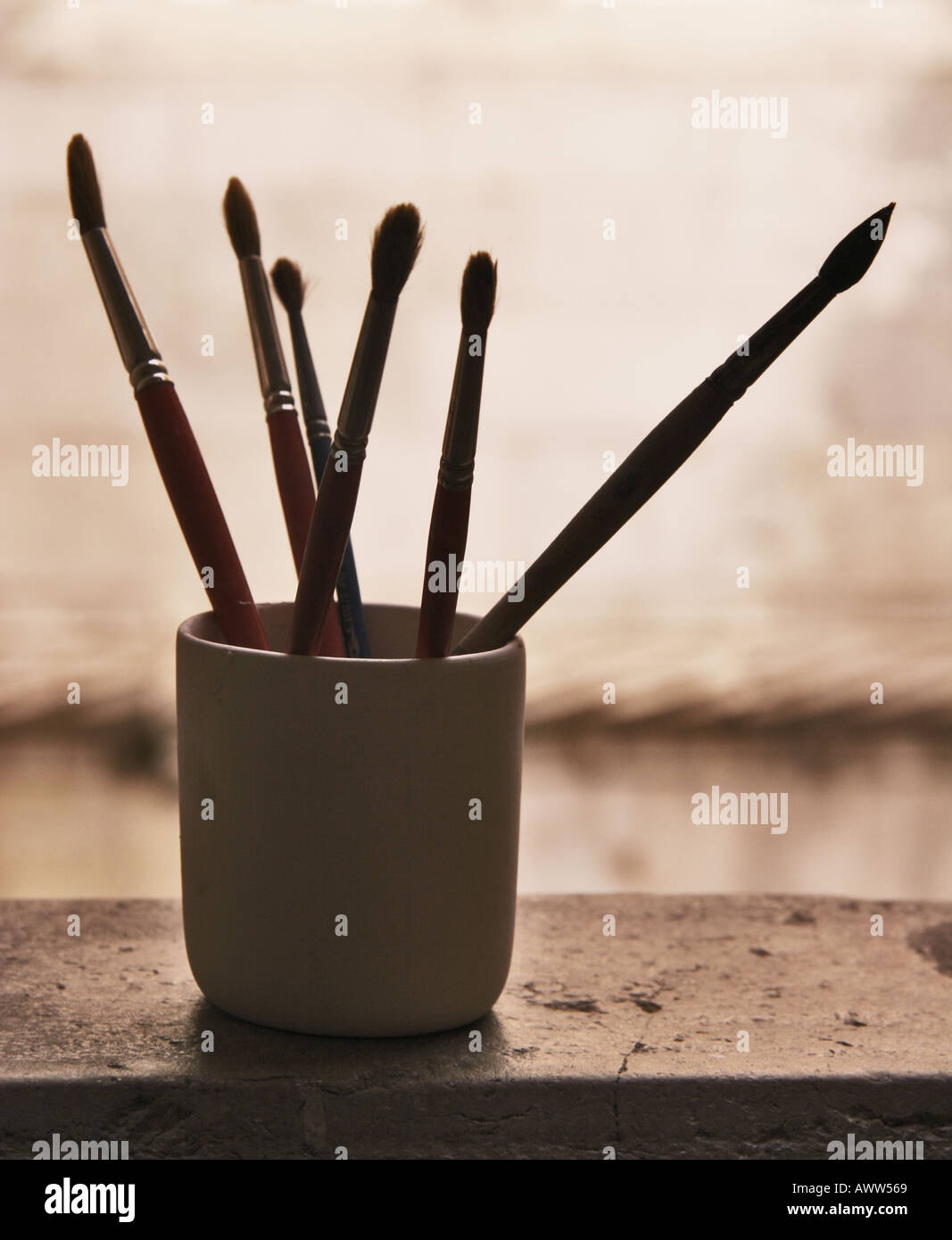 Artists paint brushes in mug Stock Photo