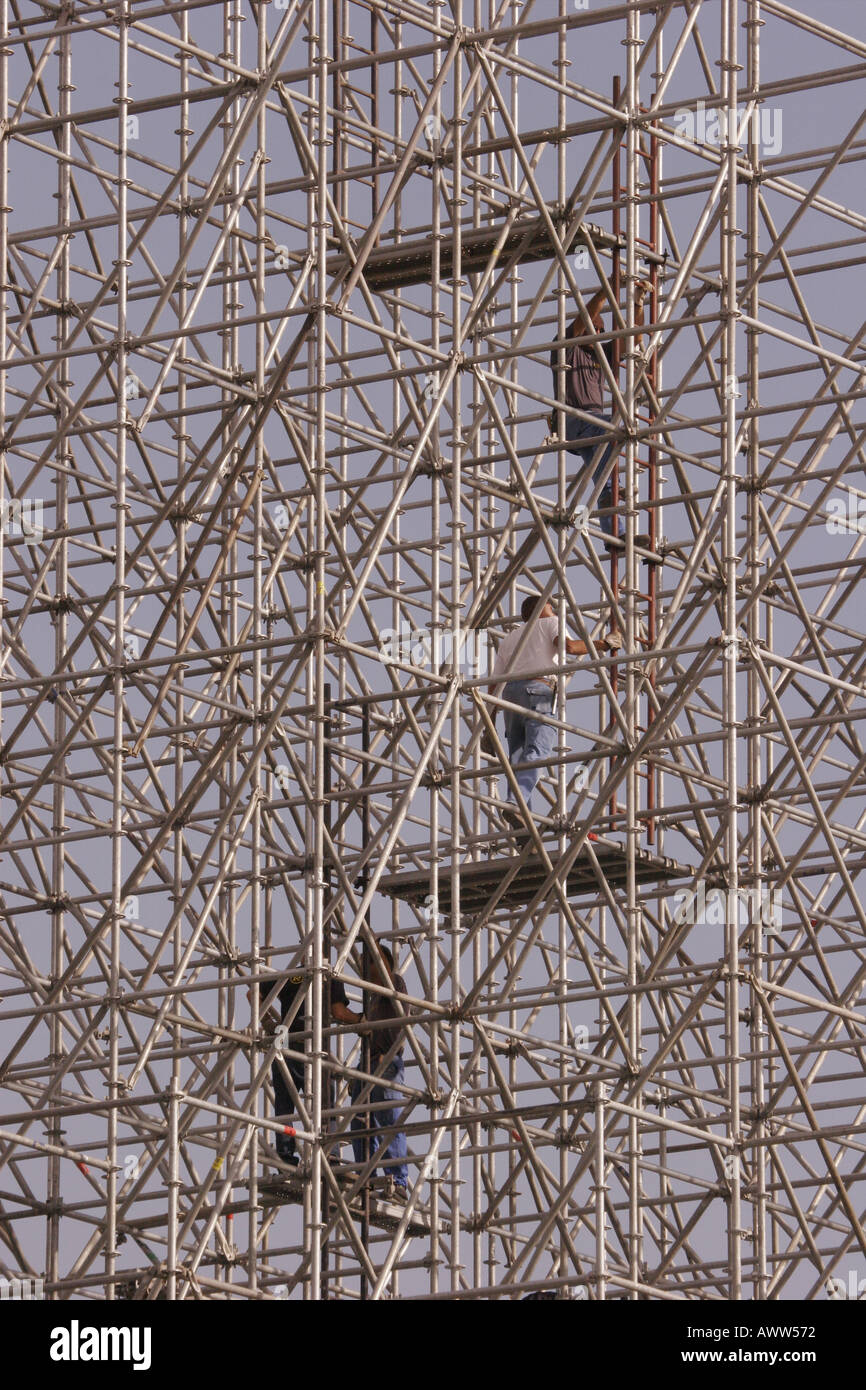 Men amongst scaffolding Stock Photo