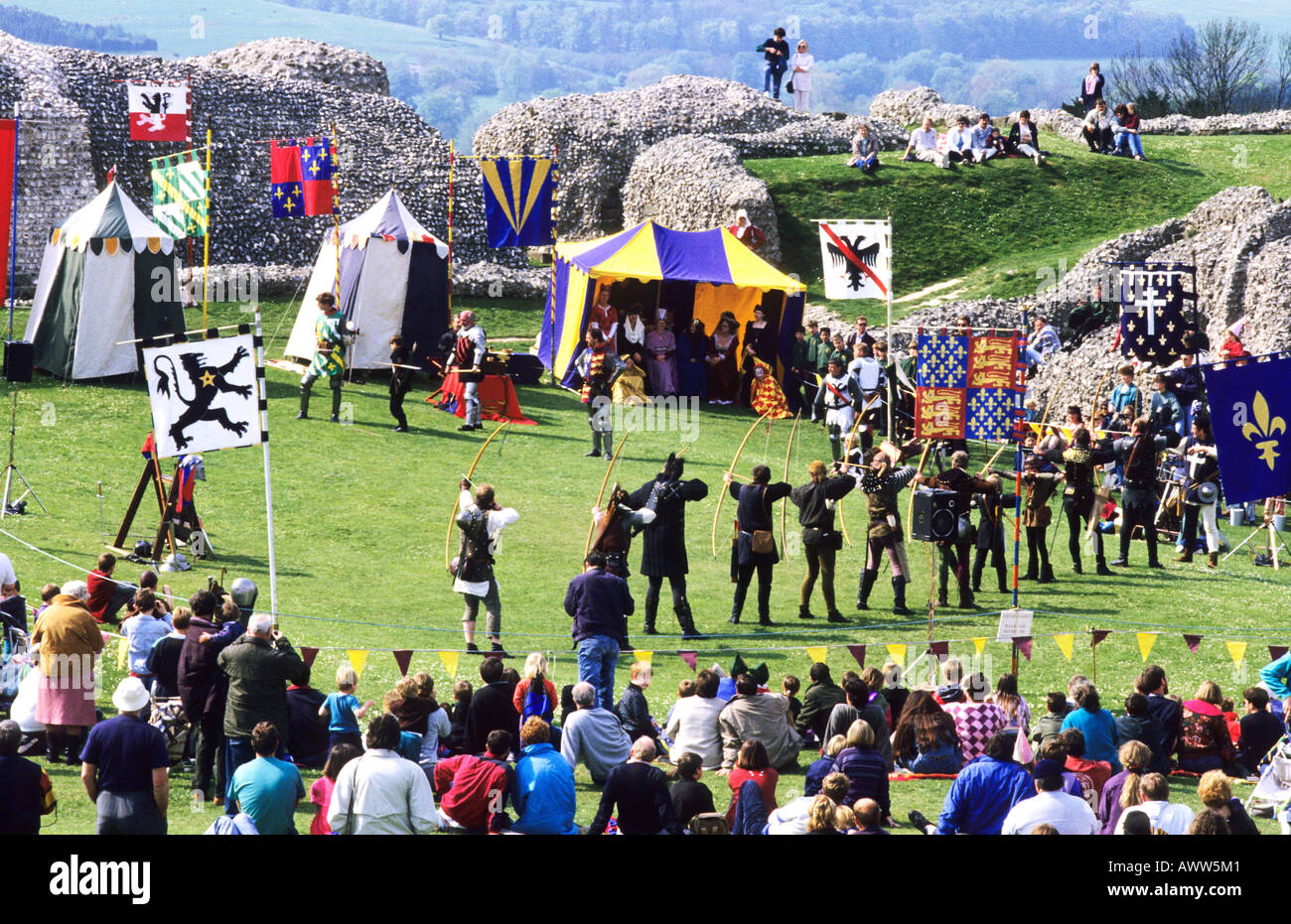 Medieval re enactment Archery long bows spectators coats of arms ...