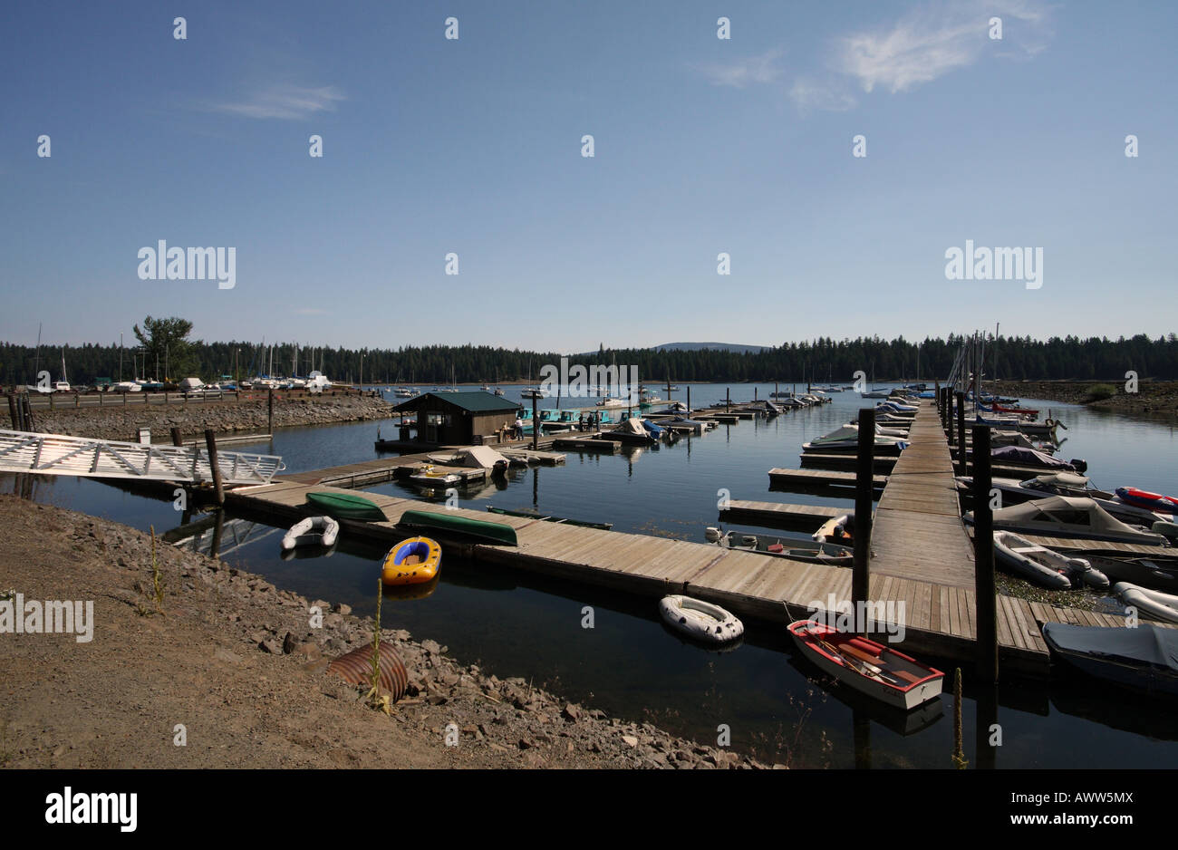 A marina on a lake with lots of boats moored up Stock Photo - Alamy