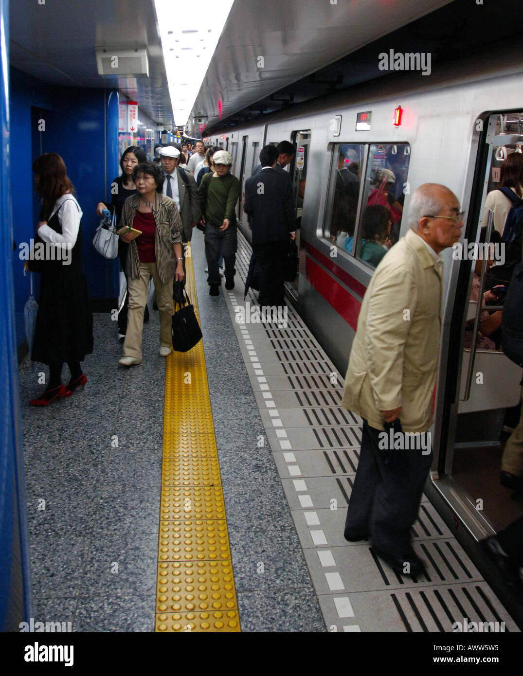 Commuters boarding a subway train, Tokyo Japan Stock Photo