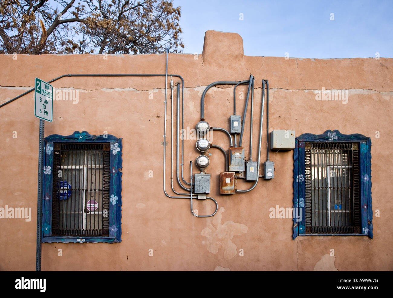 Power Cables and windows on external Wall, Albuquerque, New Mexico Stock Photo