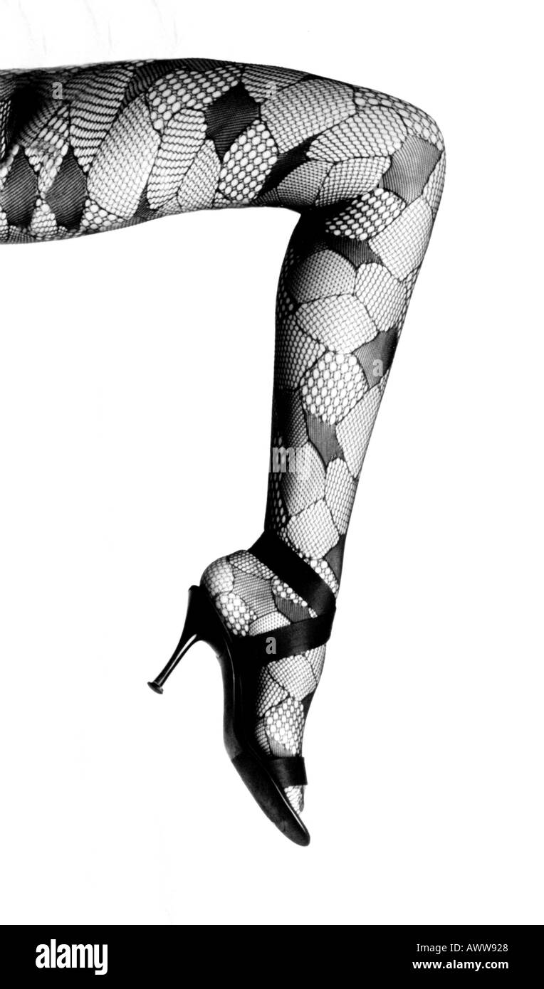 Womans Leg in Patterned Tights and High Heeled Shoe Stock Photo