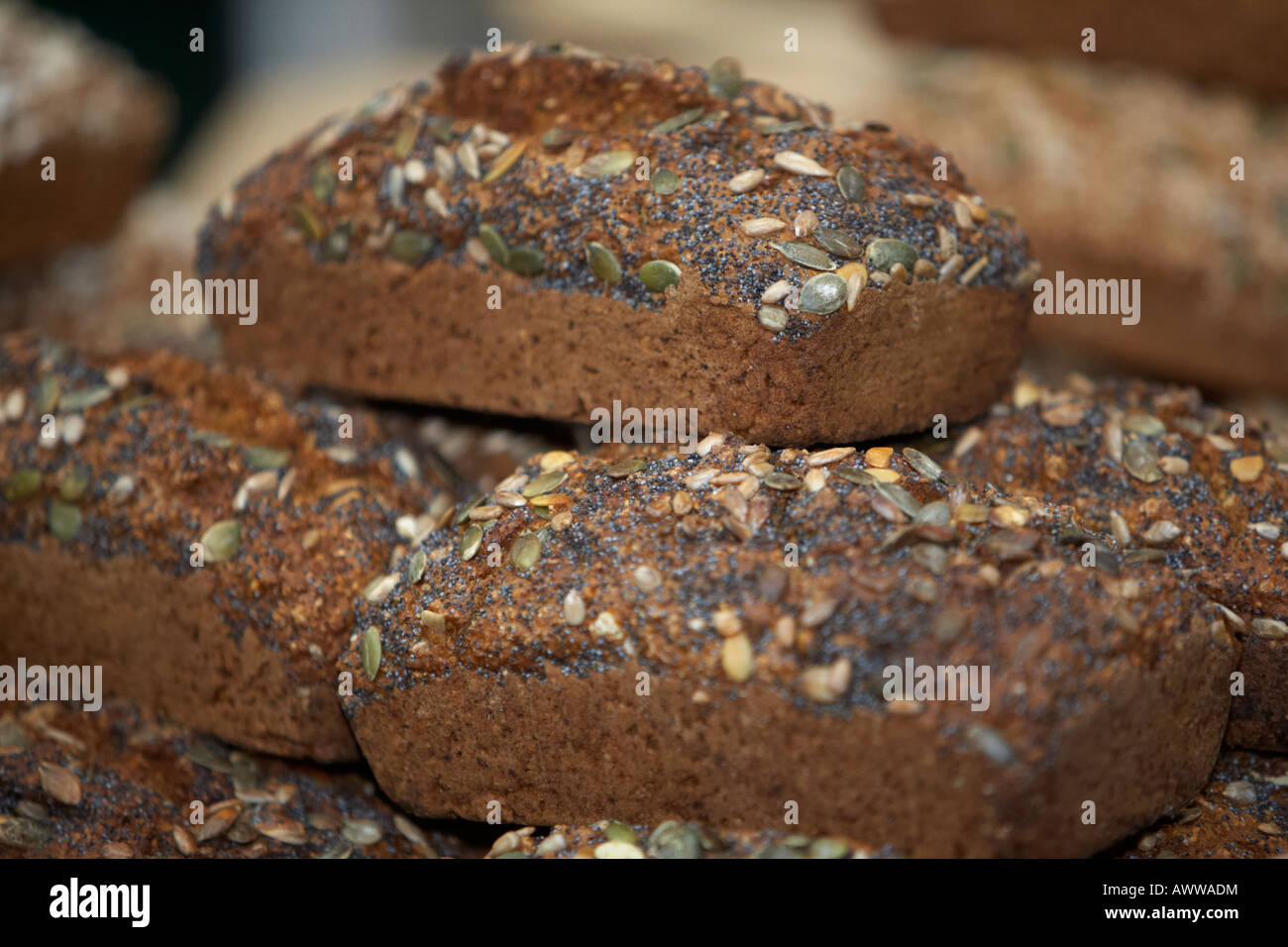 organic wholemeal poppy and sunflower seeded seed bread on sale at a farmers market in belfast Stock Photo