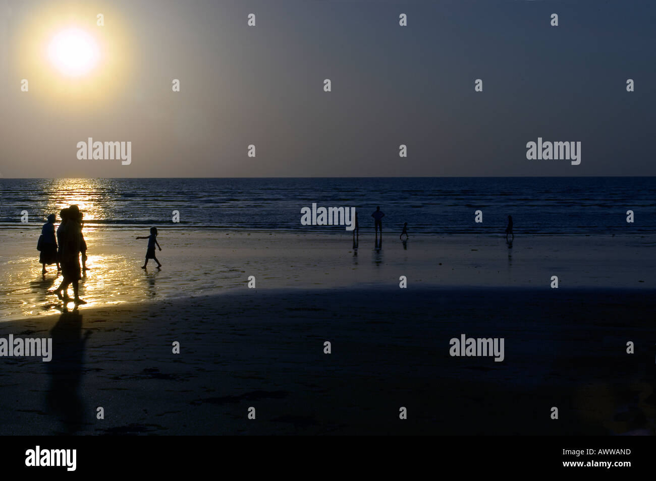 Sunset Silhouettes on Beach Stock Photo - Alamy