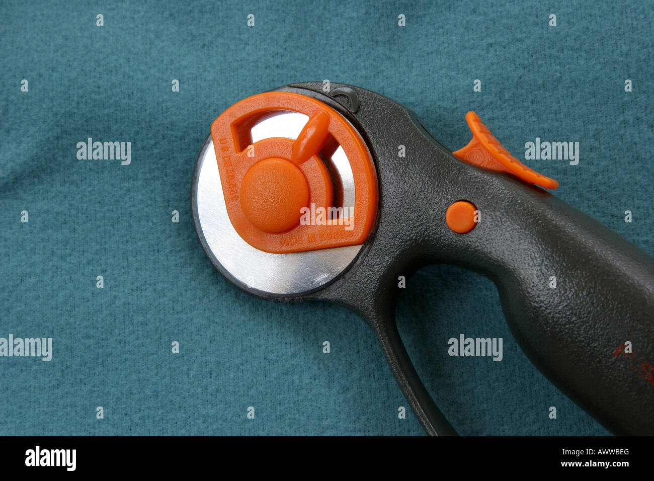 Fiskars brand rotary cutter for fabric and paper uses sharpened wheel