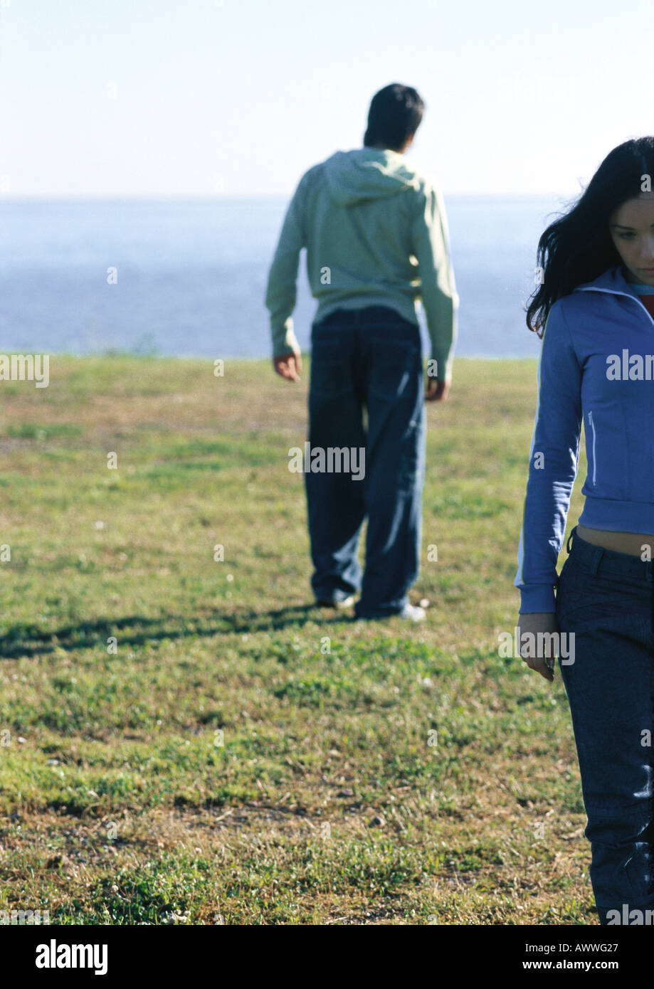 Young couple walking away from one another Stock Photo Alamy