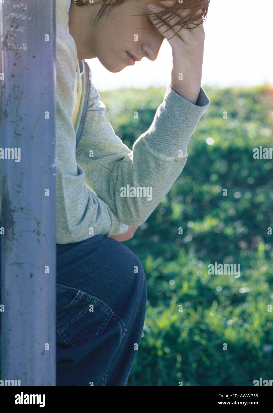 Boy sitting head down sad hires stock photography and images Alamy