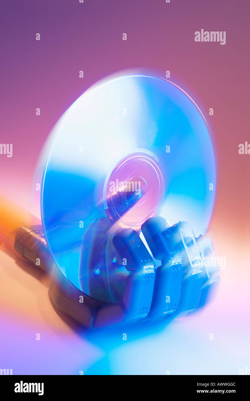 Toy Robot Hand Holding CD Stock Photo