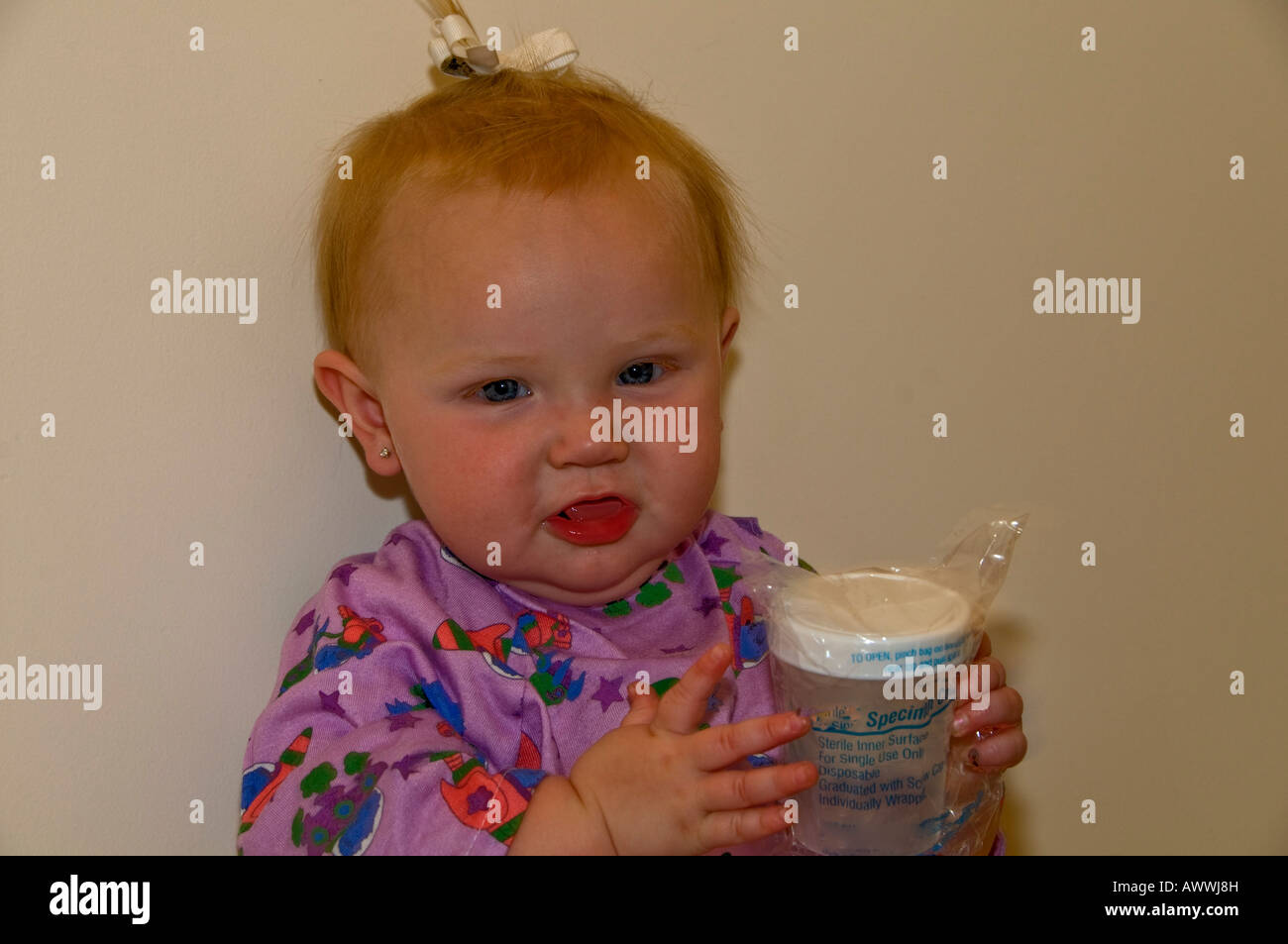 Baby Patient Holding Plastic Cup Stock Photo Alamy