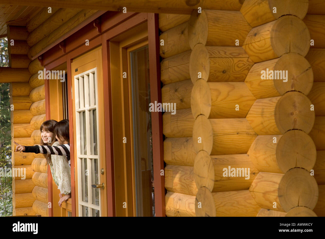 Two young women in doorway Stock Photo - Alamy