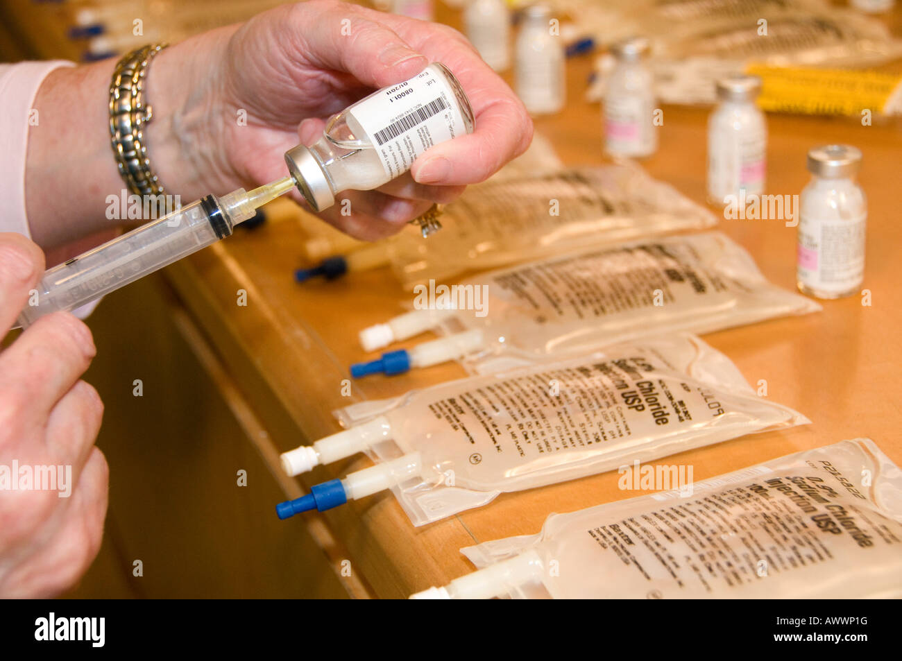 Nurse Preparing IV Medication For Patient Asembly Line Stock Photo - Alamy