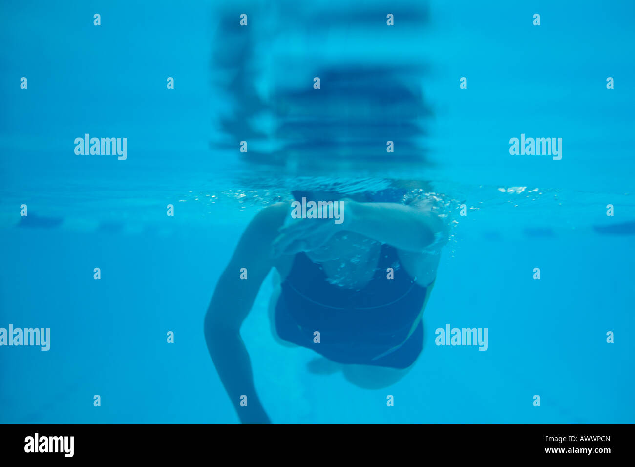 Underwater view of female swimming in pool Stock Photo - Alamy