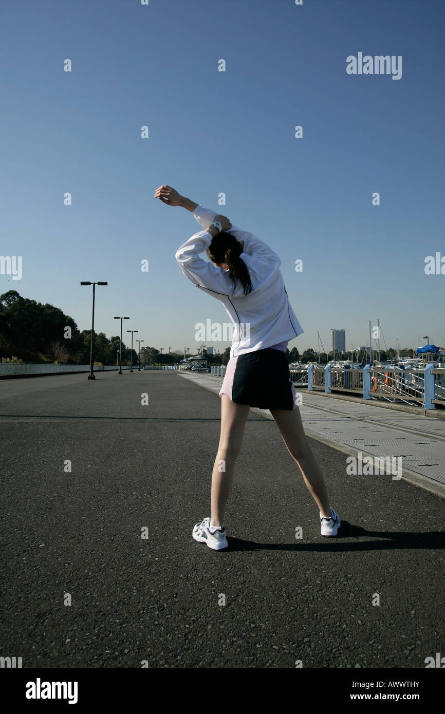 Woman arms raised rear view sky hi-res stock photography and images - Alamy