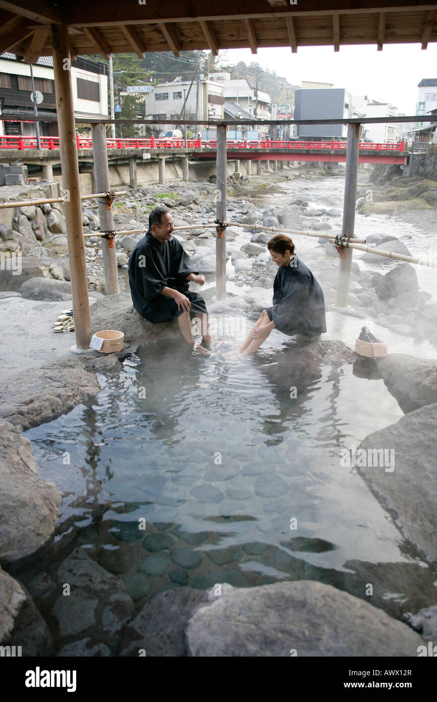 Man and woman sitting in japanese spa Stock Photo