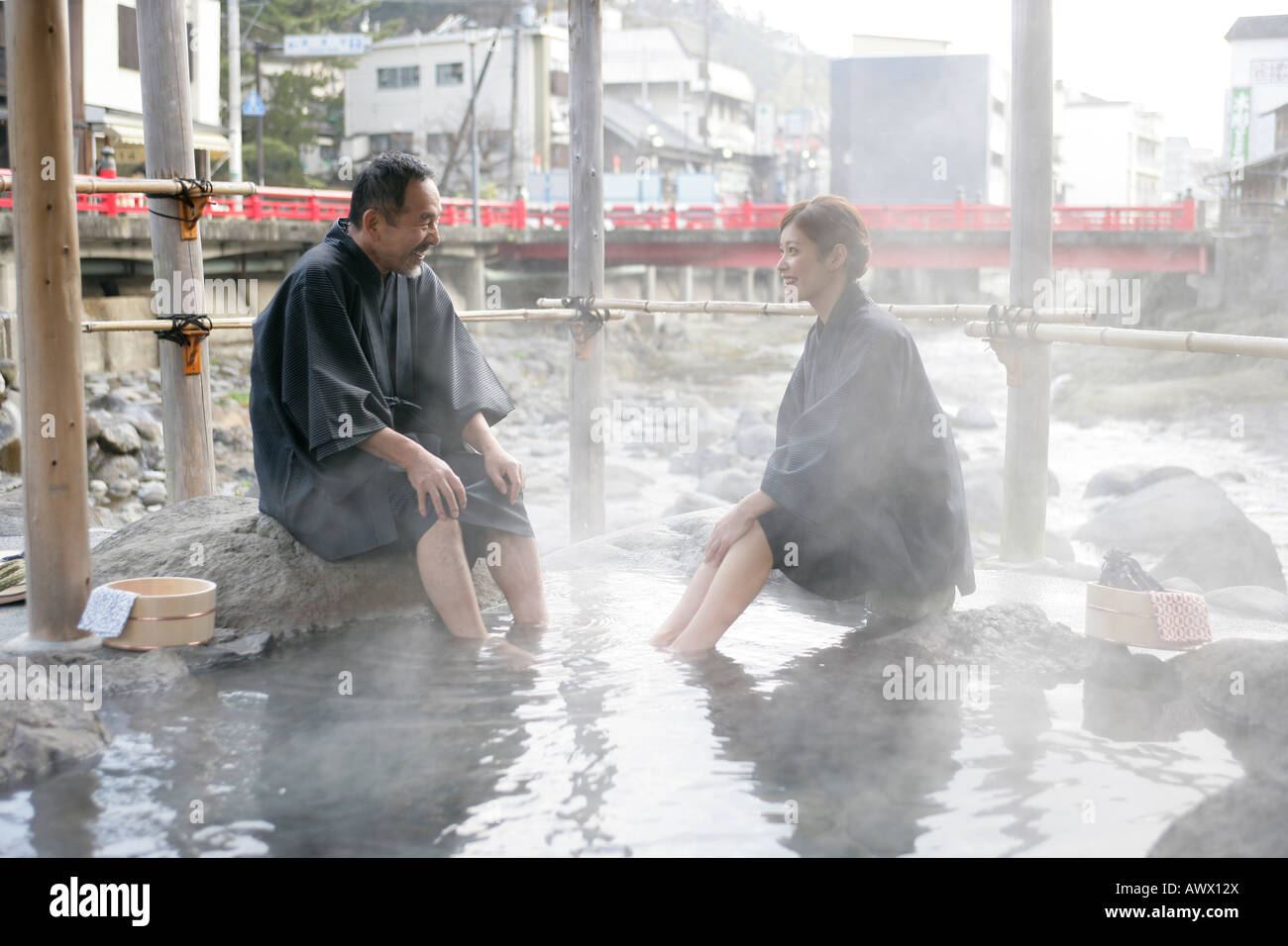 Man and woman sitting in japanese spa Stock Photo