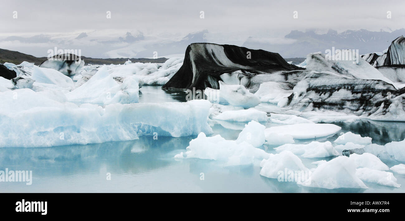 glacierlake Joekulsarlon, icebergs covered with volcanic ashes, Iceland, Joekulsarlon Stock Photo
