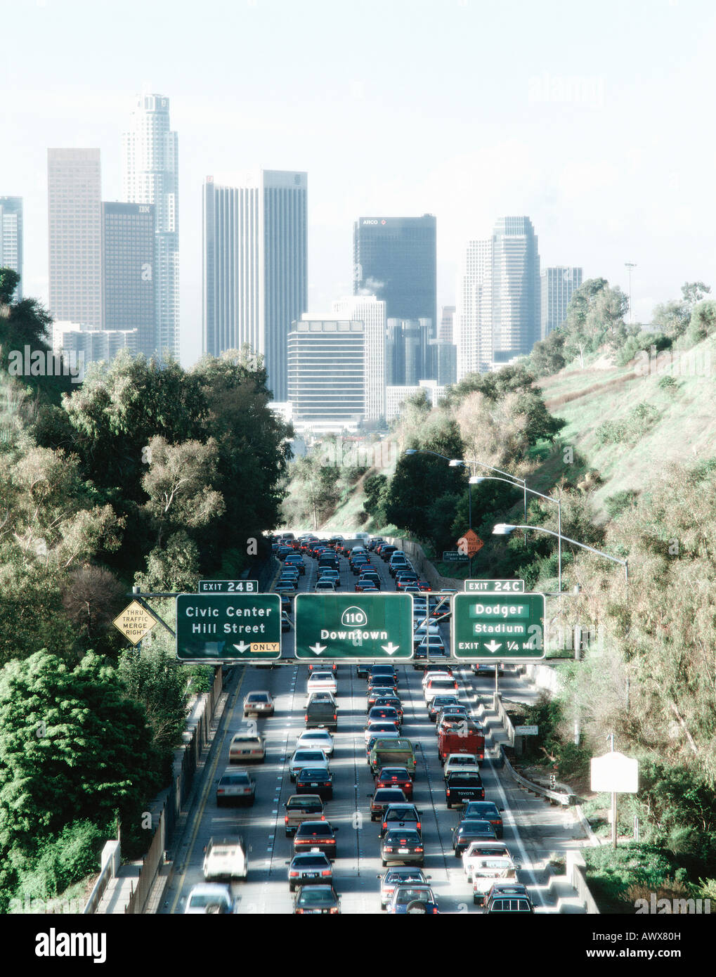 Digitally altered, high contrast image of morning rush hour traffic on Pasadena Freeway into downtown Los Angeles, California Stock Photo