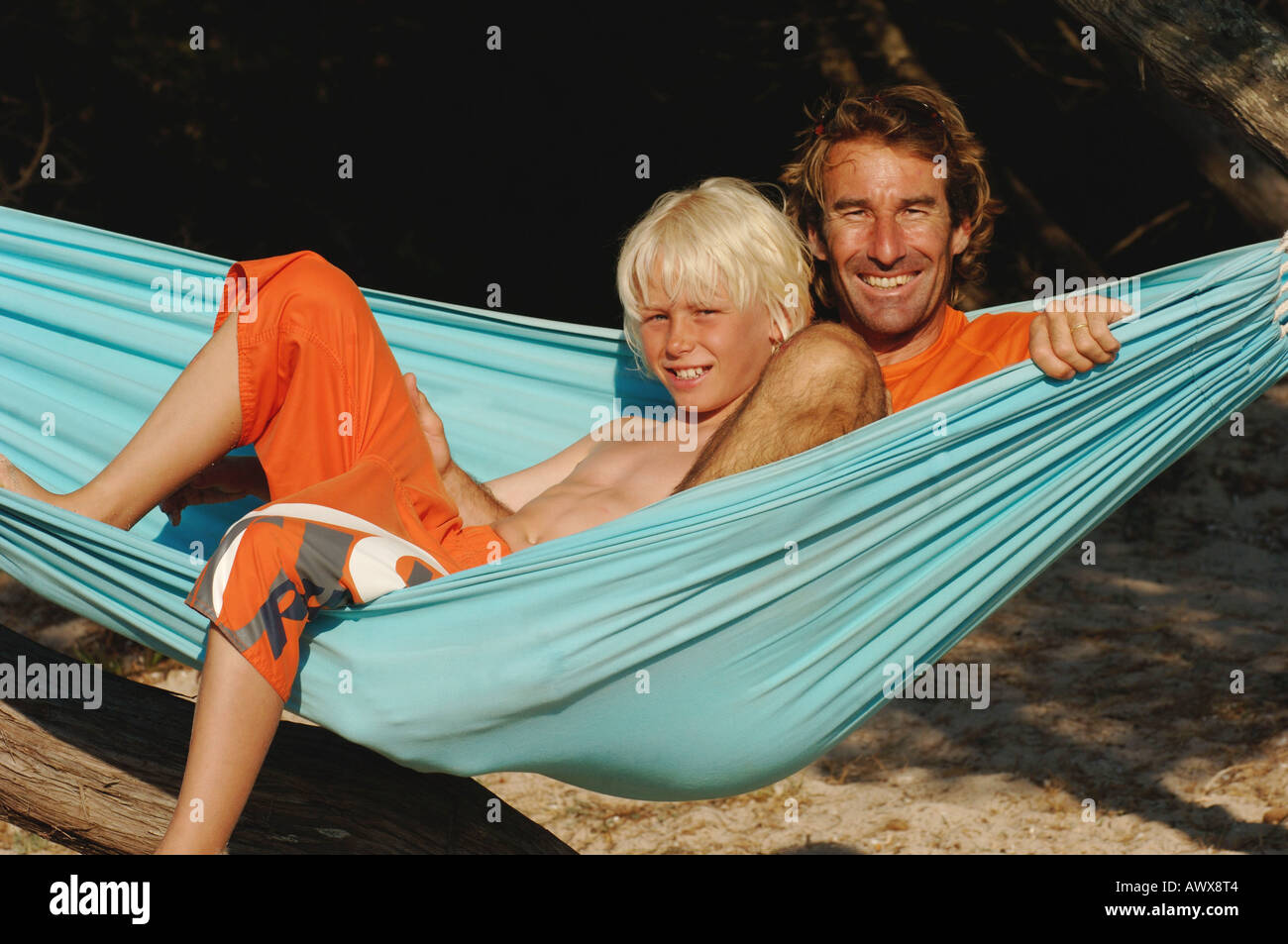 son and father in hammock Stock Photo