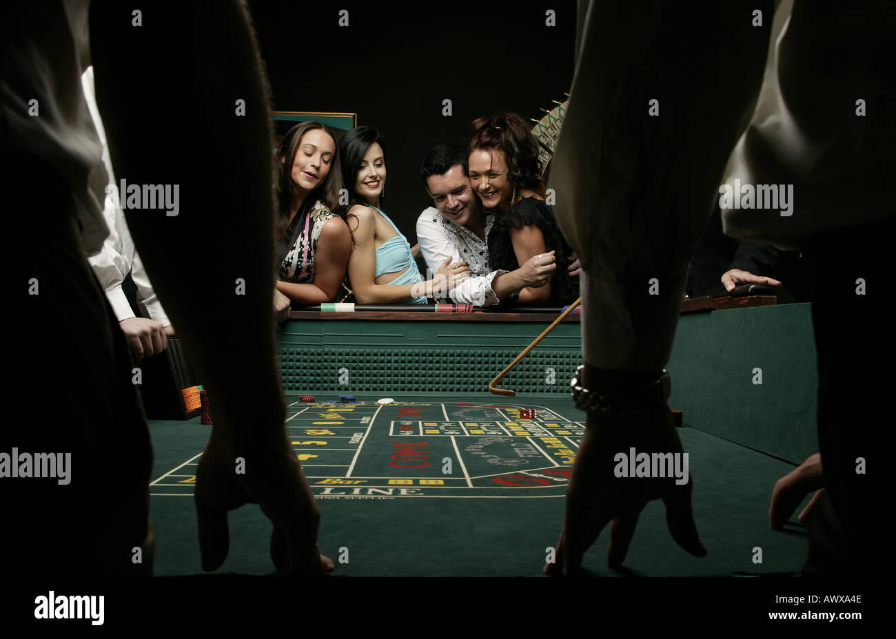 Man throwing dice at craps table hires stock photography and images