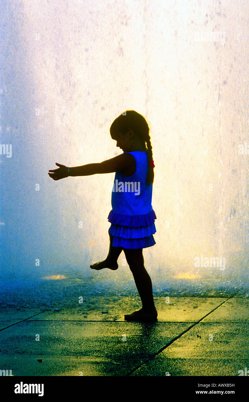 Digitally altered image of a little girl playing in fountain at Dorothy ...