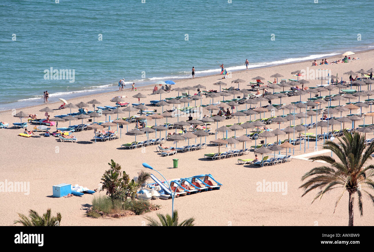Aerial view of sandy beach and holidaymakers on vacation in the sun Stock Photo