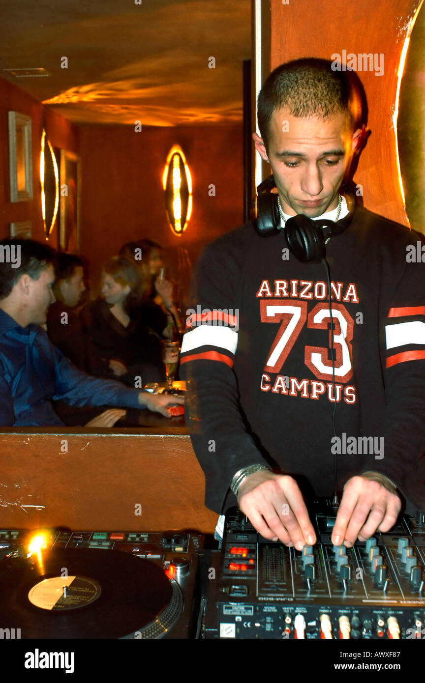 PARIS France, Male Arab 'DJ Spinning' in African Theme Bar Restaurant 'L'Impala Lounge' 'Disk Jockey' Stock Photo