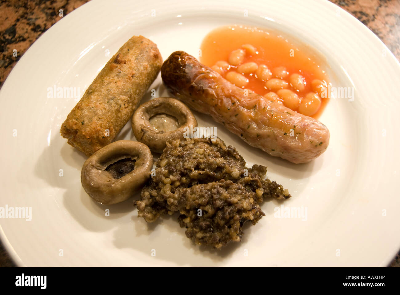 Scottish breakfast of Haggis, sausage, baked beans, mushrooms at a