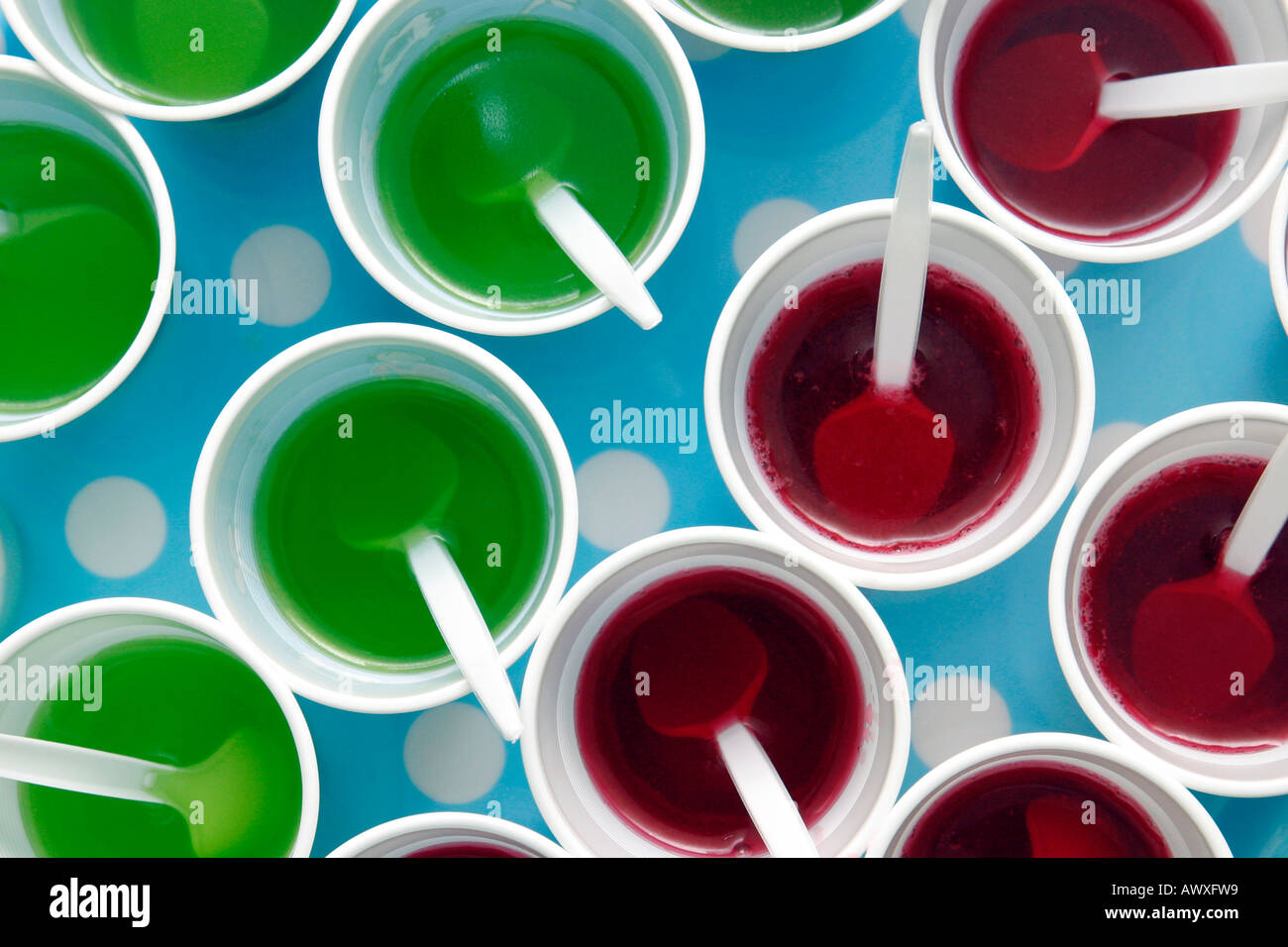 red and green jelly set in plastic cups on a tray in preparation for a  childrens party Stock Photo - Alamy