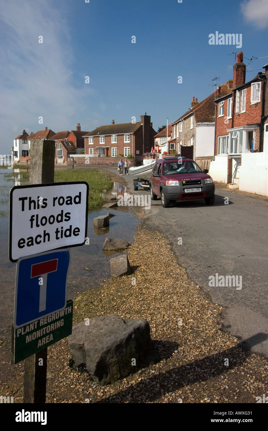 Flood warning sign. Vehicles. Old Bosham waterfront, shore. West Sussex  England UK Stock Photo - Alamy