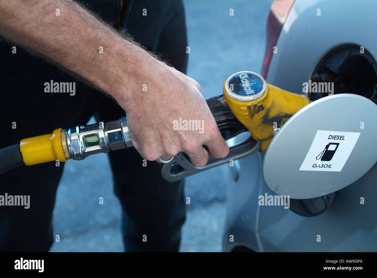 Man putting petrol in car Stock Photo Alamy
