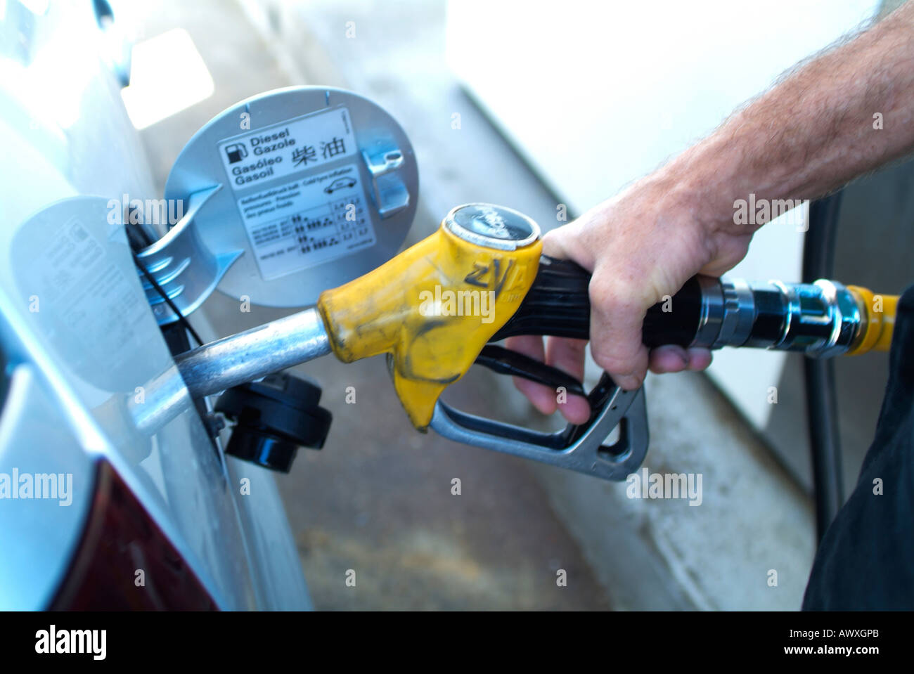 Man putting petrol in car Stock Photo Alamy