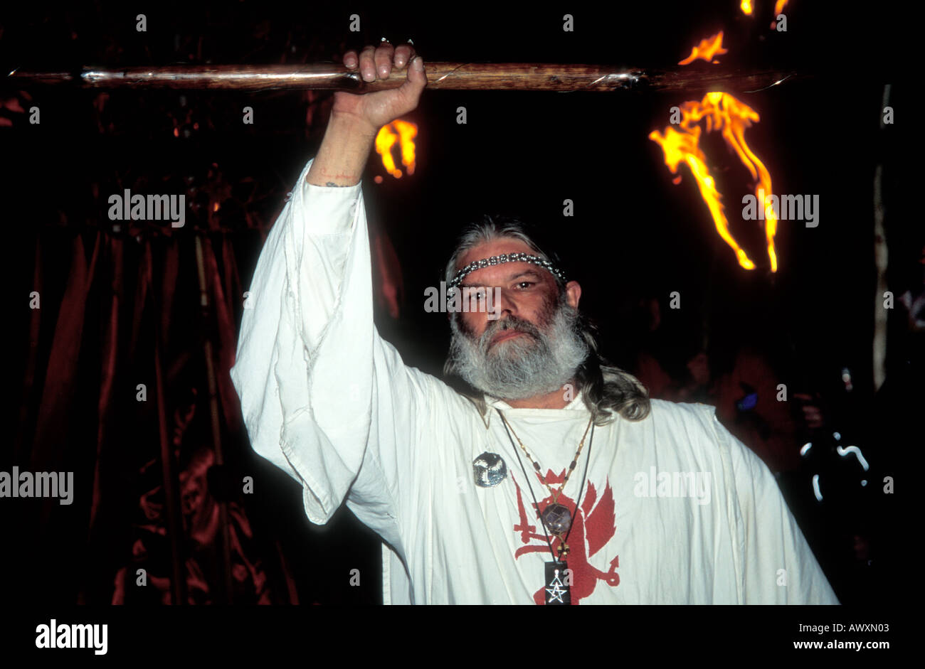 King Arthur chief Druid summer solstice at Stonehenge with fire torch