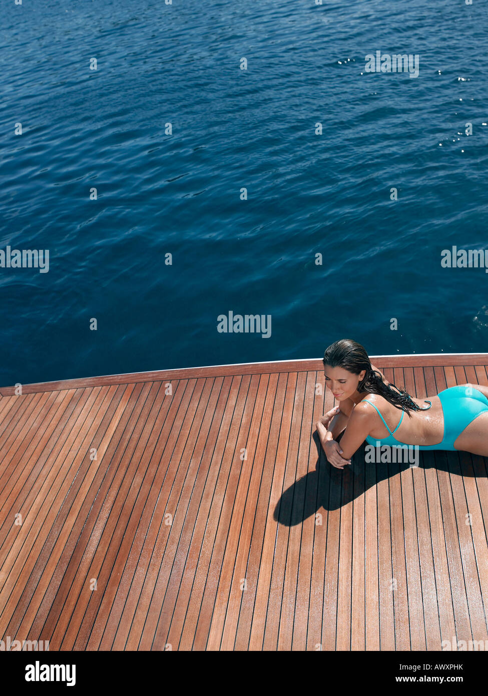 Young Woman Sunbathing On Yacht High Resolution Stock Photography and