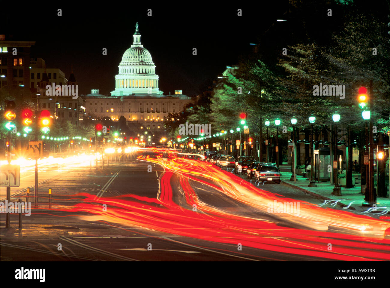 Washington, D.C., USA, U.S. Capitol, west facade, Pennsylvania Avenue with car light streaks at night Stock Photo